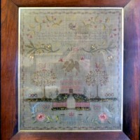 A William IV wool and silkwork sampler within a rosewood frame Hammer:  £850 