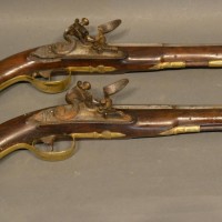 A Pair Of Late 18th Or Early 19th Century Probably Continental Flint Lock Pistols, with inlaid barrels and stocks, 22cm barrels Hammer; £2,500