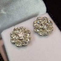 A pair of 18ct. white gold diamond cluster earrings Hammer:  £2,000