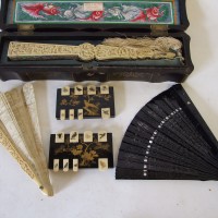 A pair of Japanese lacquered and gilt decorated markers and carved ivory fan. Hammer £3100